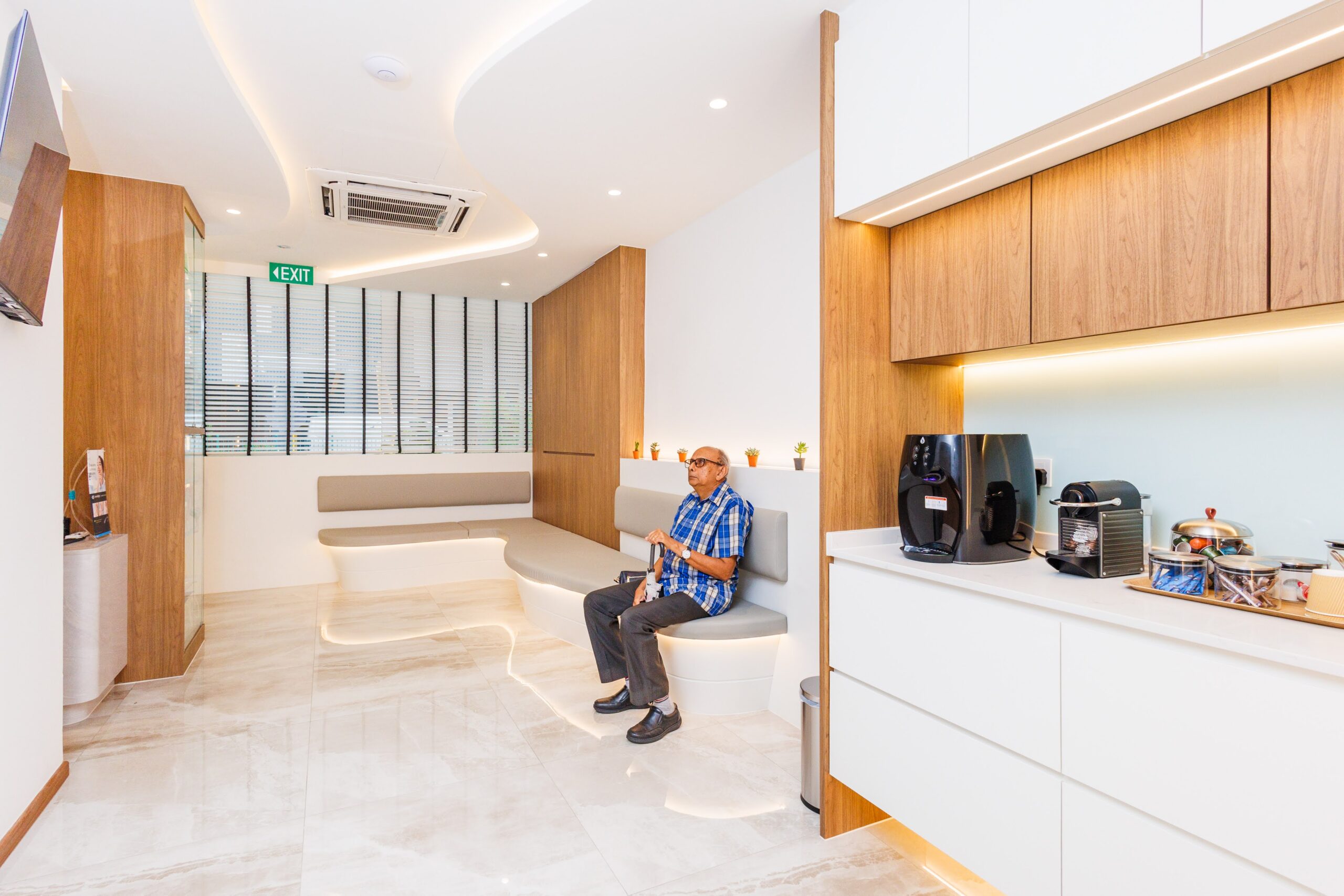 Waiting area with seating and coffee station